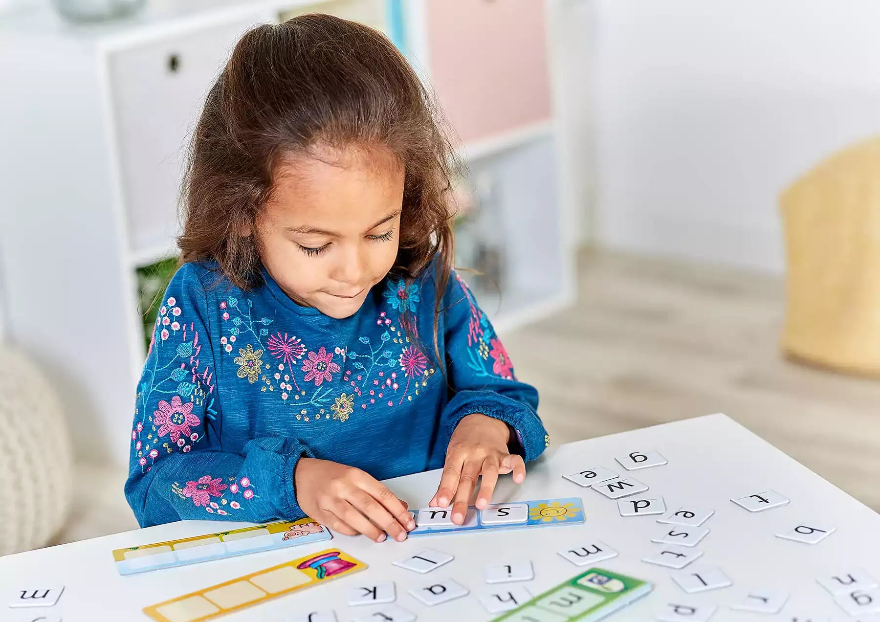 Girl learning and playing with Match and Spell Linguistics Game
