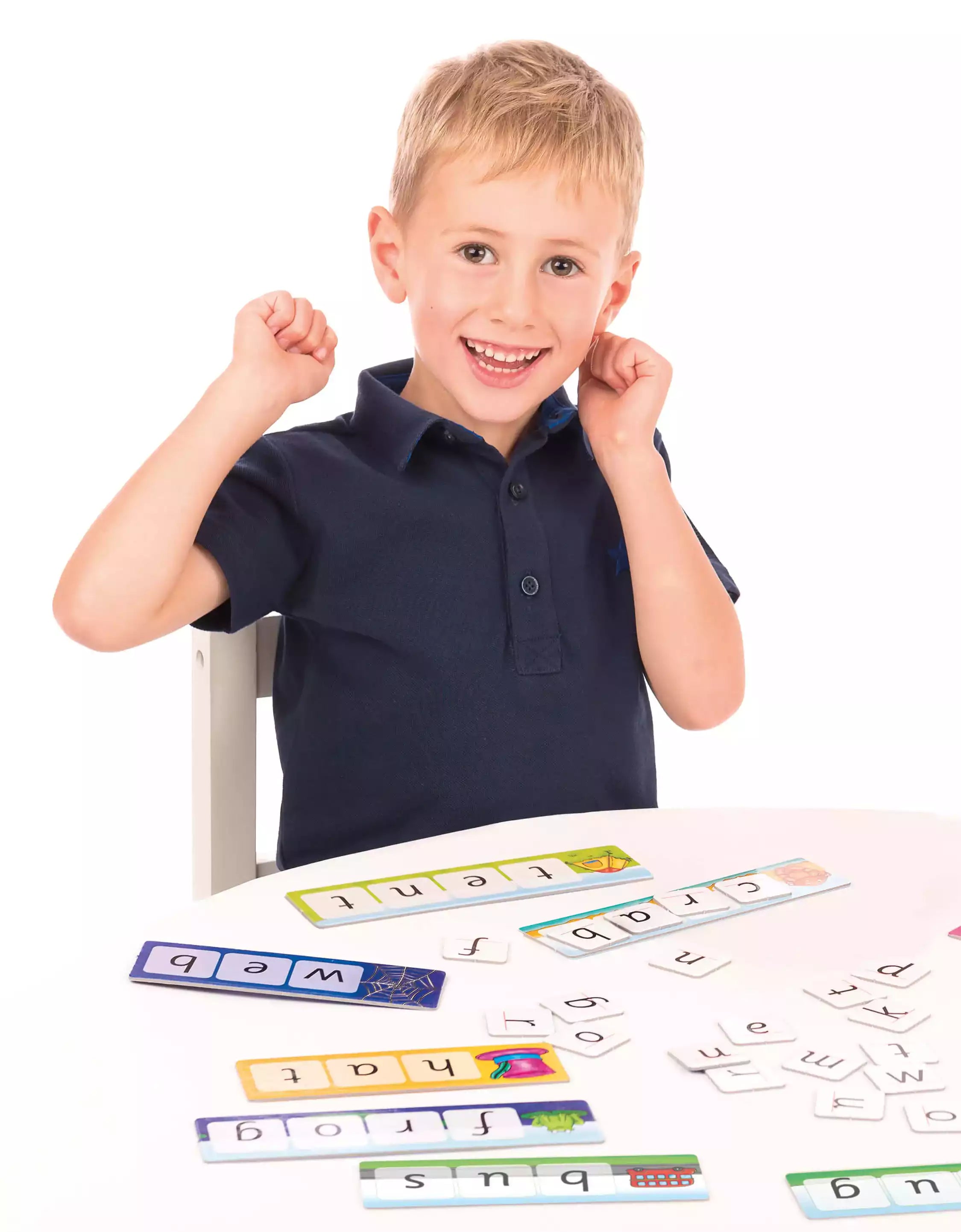 Happy Kid with contents of Match and Spell game