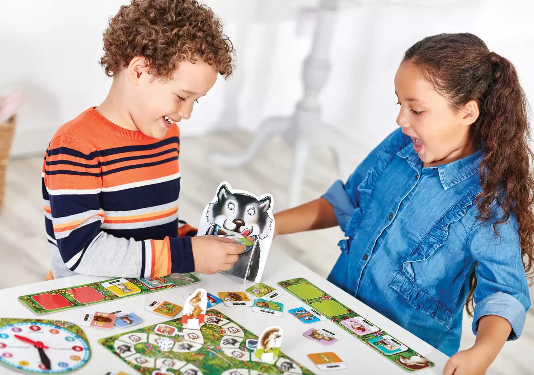 Children playing with What's the time Mr. Wolf Orchard toys - Board games for children