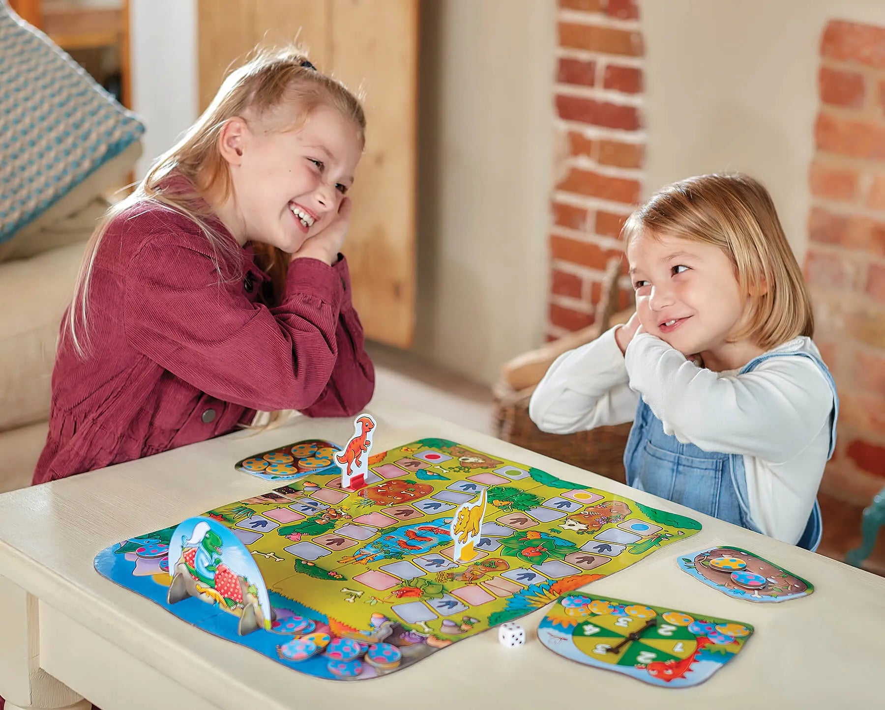 Children playing and enjoying Dino-Snore-Us from Orchard toys