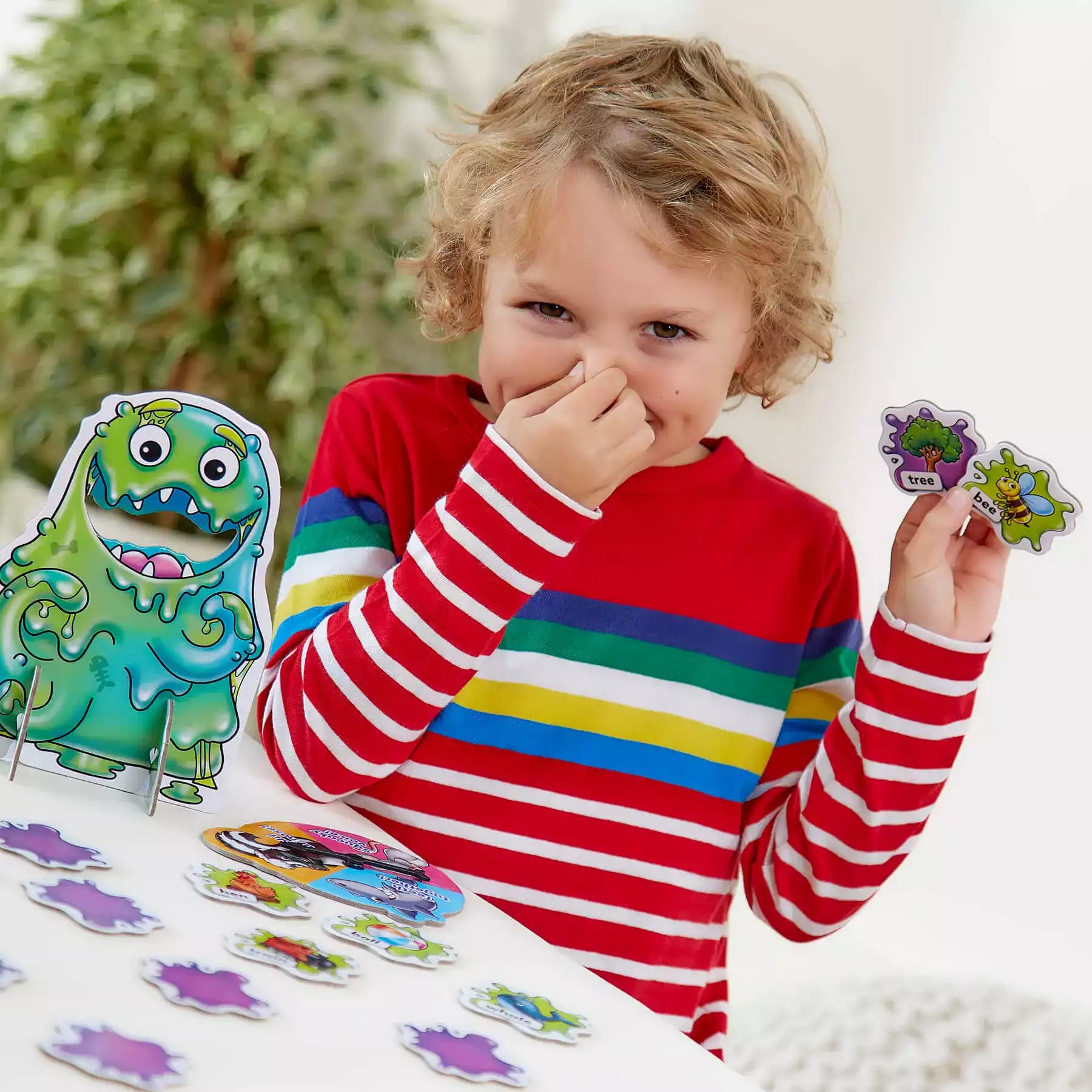 Children reacting with Slimy Rhymes - learning made fun with orchard toys