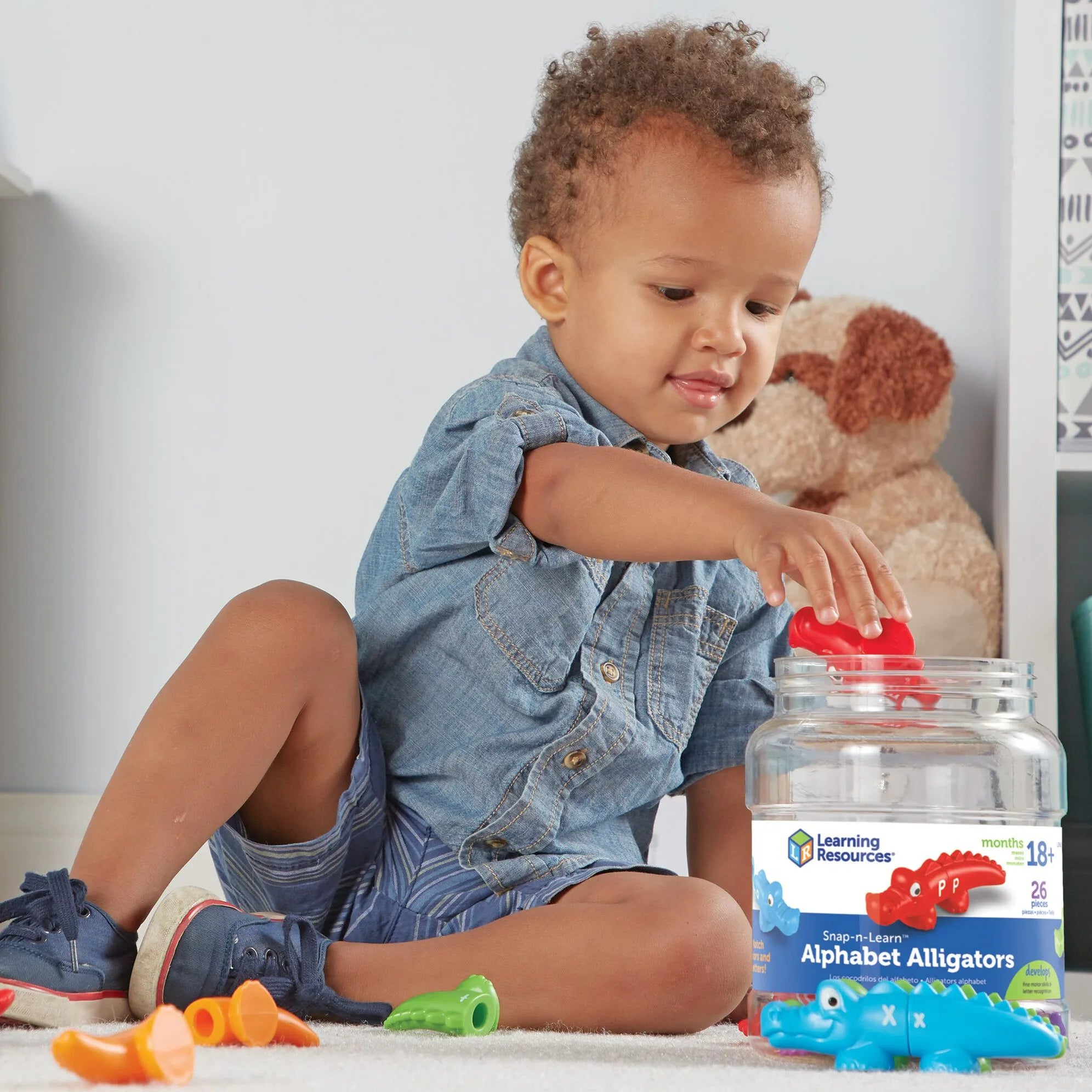 boy playing with alpha gators - learning resources toys