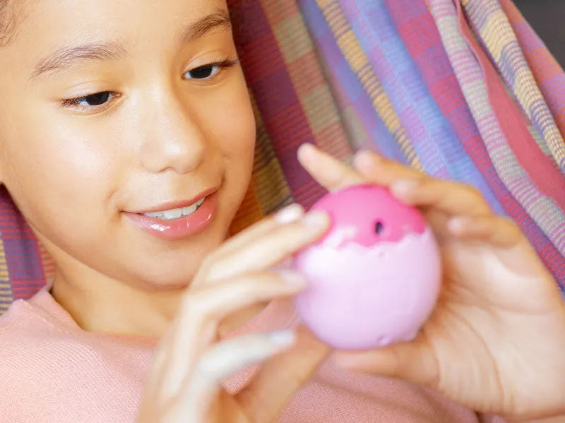 girl playing with tamagotchi toy - shop tamagotchi pix - tamagotchi pix at The Toy Room