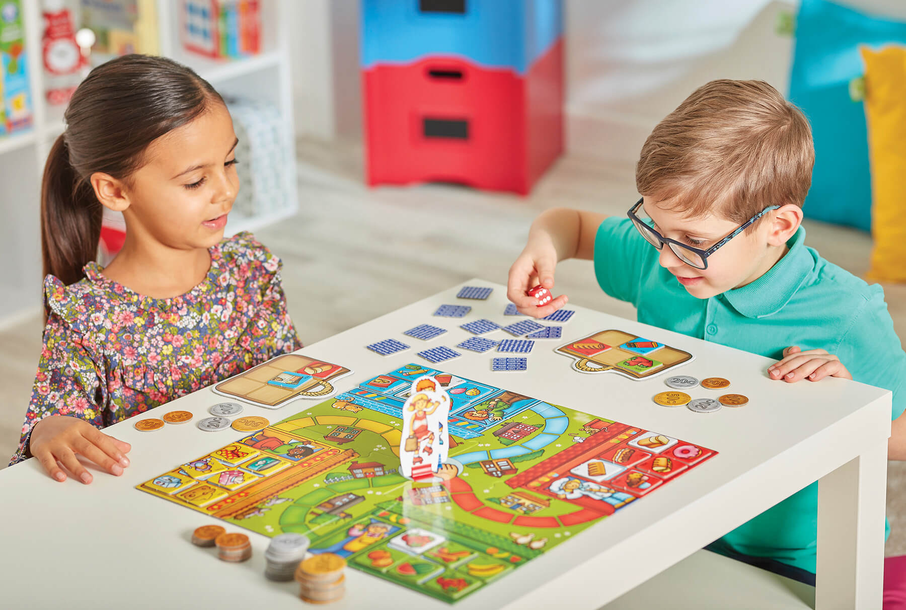 children playing pop to the shops educational board game - orchard toys