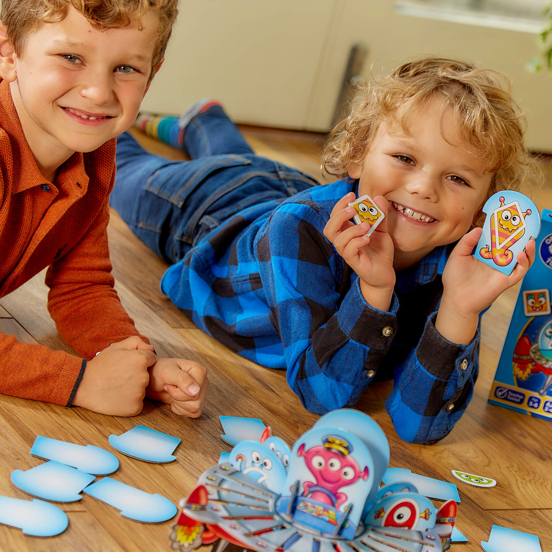 Kid with contents of Shape Aliens Game