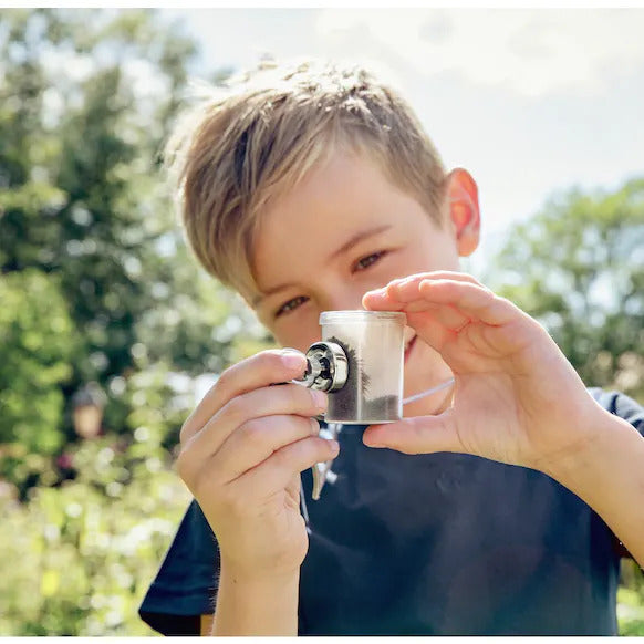 boy exploring with Haba science toy terra magnets 