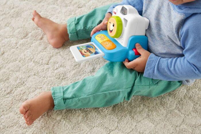 Kid enjoying Laugh & Learn Instant Camera - Fisher Price