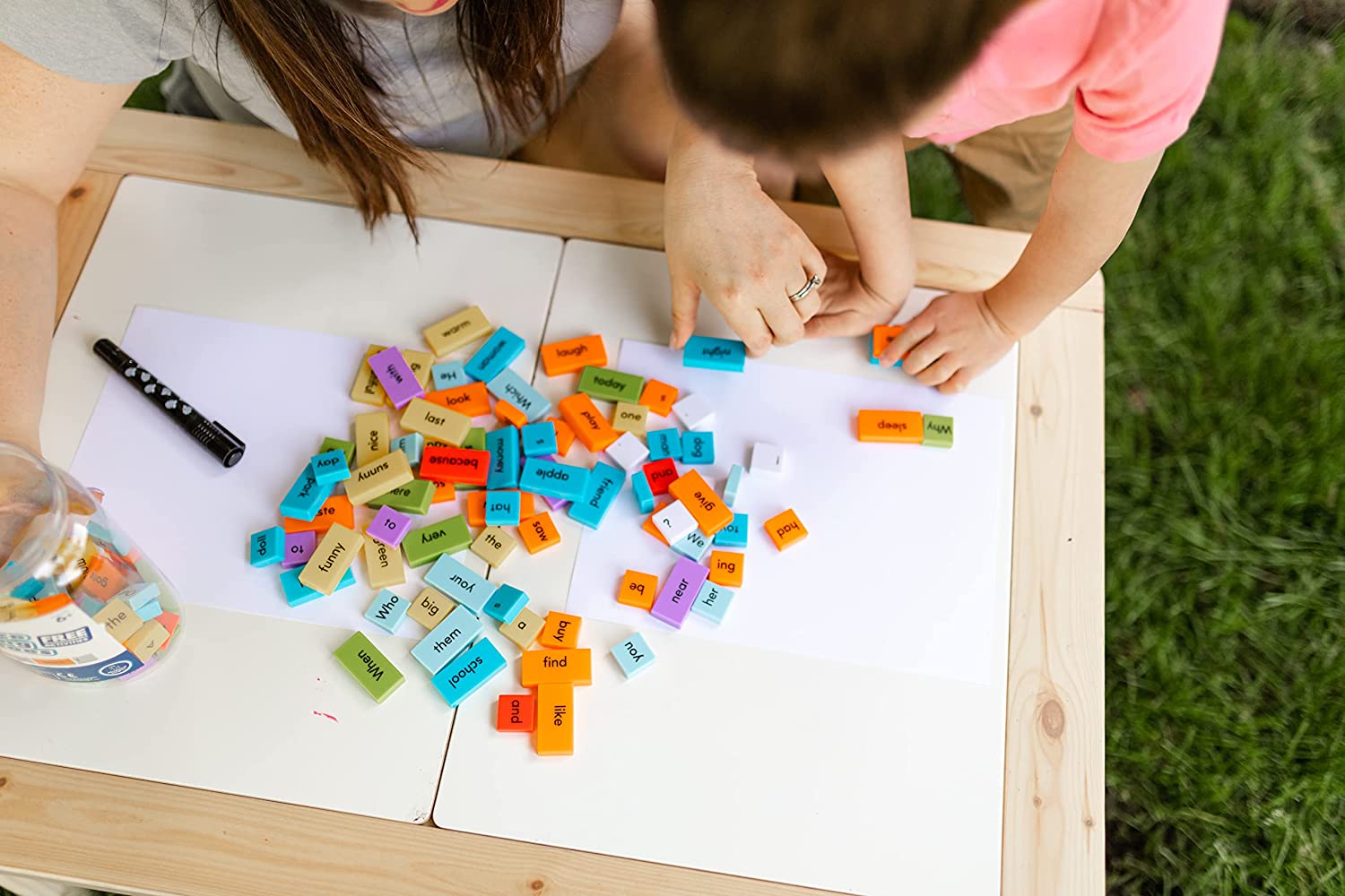 learning resources toys - children playing with sentence building dominoes